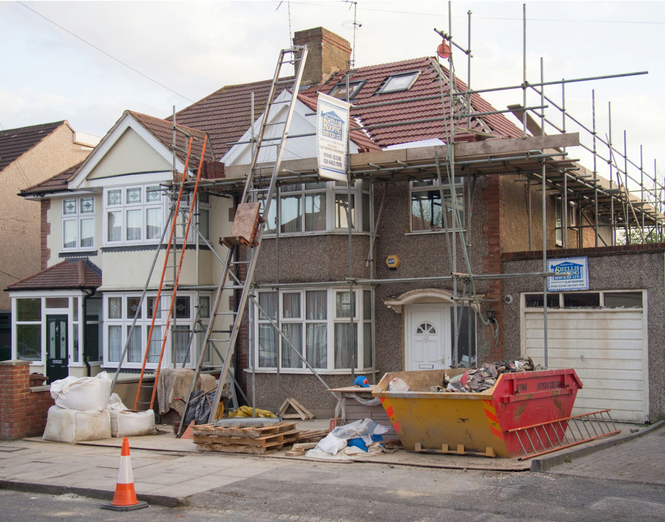Home addition and remodel under construction with structural engineering support for framing and roof design.